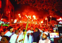 টেকনাফে কাফনের কাপড় পরে মশাল মিছিল