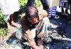 রাতের আঁধারে কার্পেটিং, হাতের টানেই উঠে যাচ্ছে পিচ